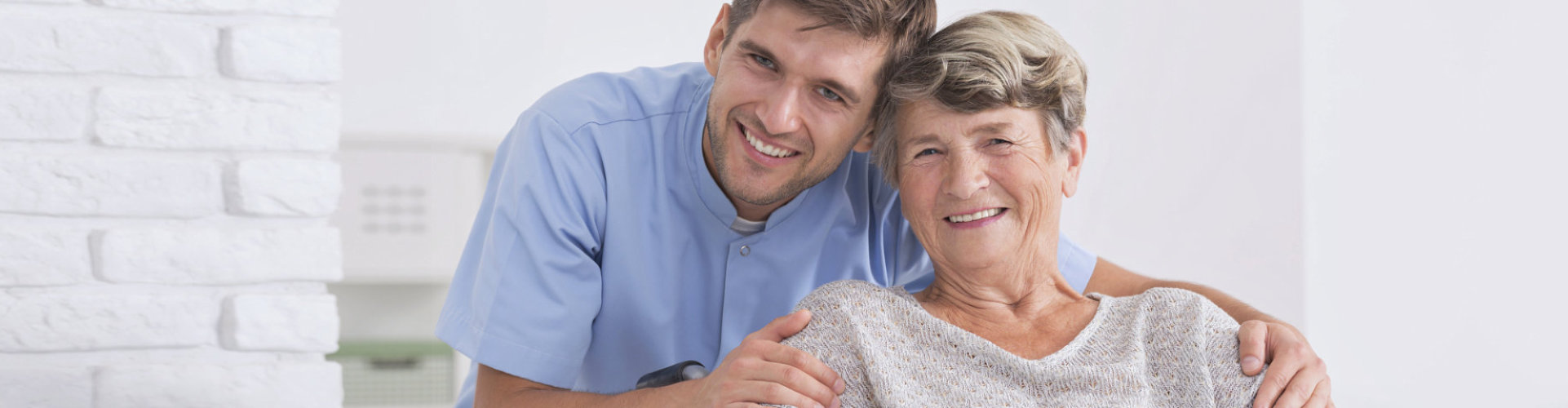 caregiver and senior woman smiling